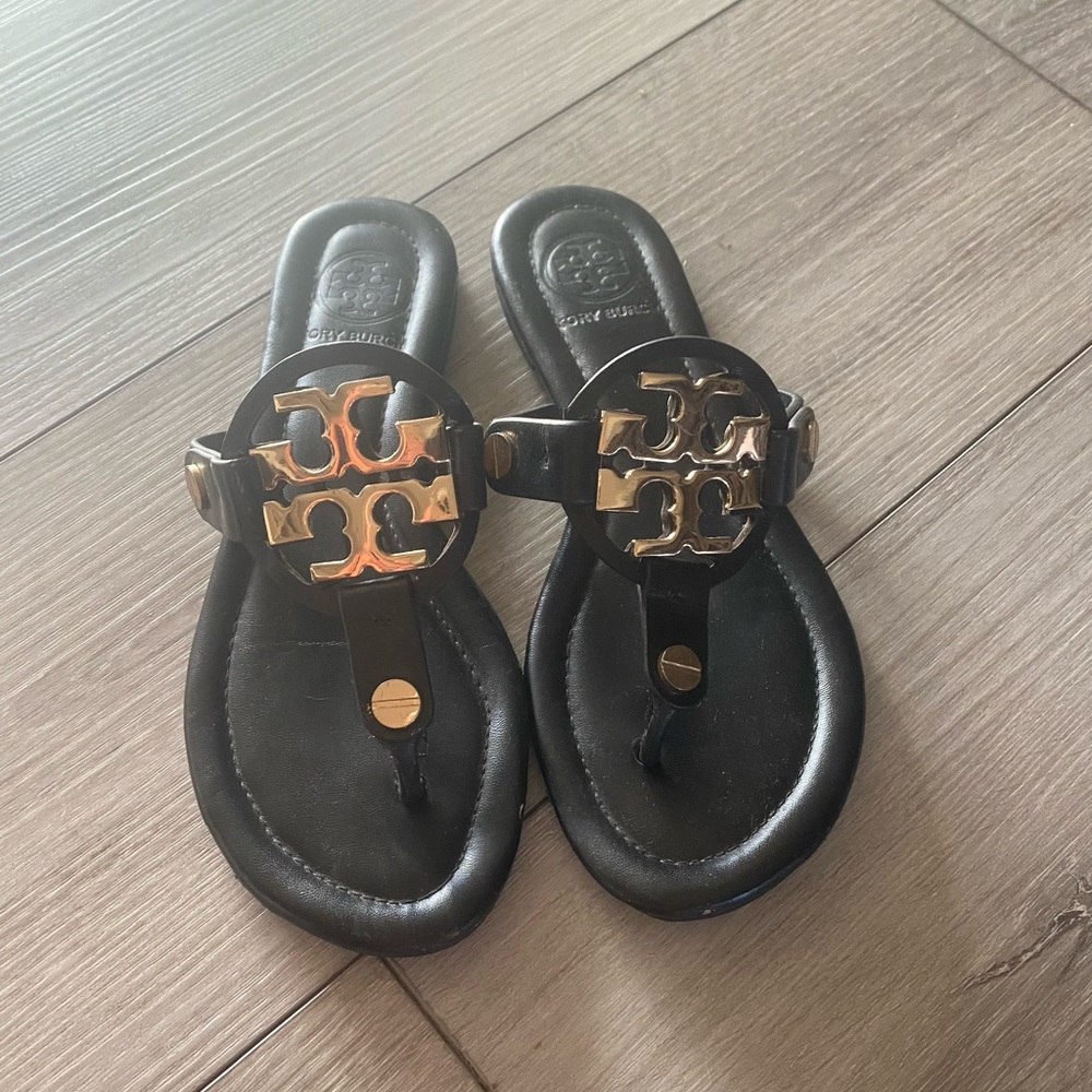Tory Burch leather sandals with gold metal emblem